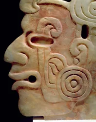 Profile of a man with earrings